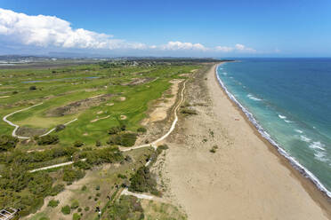 Aerial view of golf course next to the beach on the Mediterranean Sea coast of Belek, Antalya, Turkey. - AAEF19477