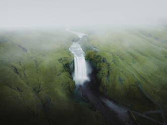 Aerial view of Skogafoss waterfall in a long exposure shot, Iceland. - AAEF19509