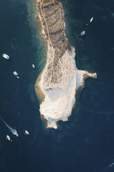 Aerial view of a rock in Malta coastline with sailing boats along the cliffs, Malta. - AAEF19517