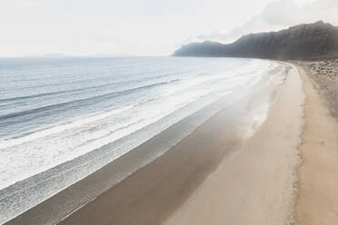 Panoramic aerial view of Famara beach, Lanzarote, Spain. - AAEF19537