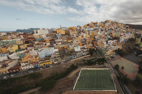 Aerial view of a soccer pitch and a little town, Las Coloradas, Spain. - AAEF19550