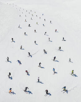 Aerial view of skiers composing a pattern, Sicily, Italy. - AAEF19589