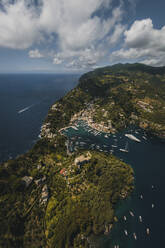 Aerial view of Portofino harbour along the coastline, Liguria, Italy. - AAEF19650