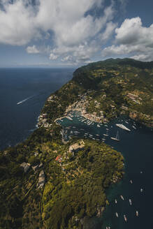 Aerial view of Portofino harbour along the coastline, Liguria, Italy. - AAEF19650