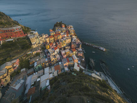 Aerial view of houses on a rock in Manarola, Cinque Terre, Liguria, Italy. - AAEF19655