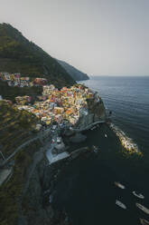 Aerial view of houses on a rock in Manarola, Cinque Terre, Liguria, Italy. - AAEF19658