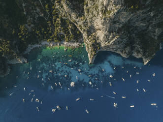 Aerial view of a coastline and boats in Capri, Naples, Italy. - AAEF19720