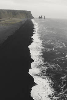 Aerial view of black sand beach and waves, Reynisfjara, Iceland. - AAEF19816