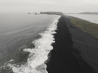 Aerial view of black sand beach and waves, Reynisfjara, Iceland. - AAEF19817