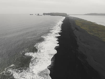 Aerial view of black sand beach and waves, Reynisfjara, Iceland. - AAEF19817