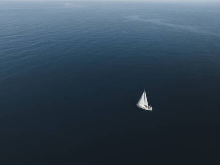 Aerial view of a sailing boat in Tindari bay, Sicily, Italy. - AAEF19830