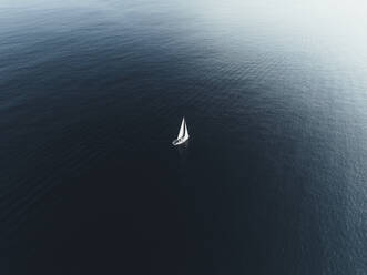 Aerial view of a boat sailing, Sicily, Italy. - AAEF19847