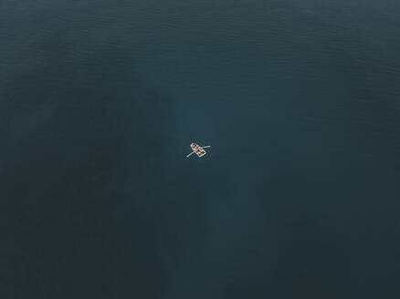 Aerial view of a fisherman's boat in Cefalù bay, Sicily, Italy. - AAEF19853