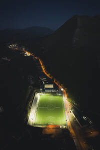 Aerial view of a football pitch at night, Gangi, Sicily, Italy. - AAEF19855