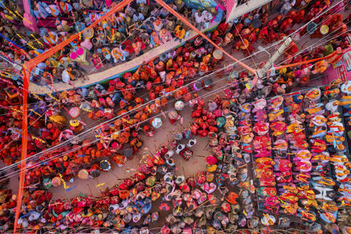 Barsana, India - 28 February 2023: Aerial view of people celebrating the holy colour festival in the street in Barsana, Uttar Pradesh, India. - AAEF19901