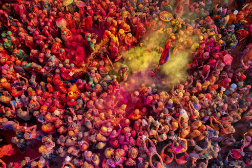 Nandgaon, India - 01 March 2023: Aerial view of people celebrating the holy colour festival at Shri And Baba Temple, Uttar Pradesh, India. - AAEF19909