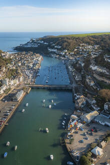 Aerial view of Looe, Looe River and iconic bridge, Cornwall, United Kingdom. - AAEF19932