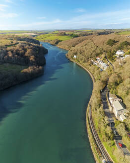 Aerial view of Looe River along side the railway line and countryside, Cornwall, United Kingdom. - AAEF19934