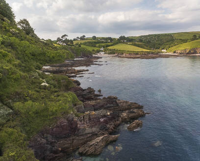 Aerial view of Talland Bay and countryside during golden hour, Cornwall, United Kingdom. - AAEF19939