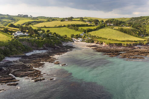 Aerial view of Talland Bay and countryside during golden hour, Cornwall, United Kingdom. - AAEF19942