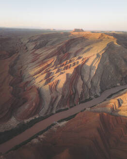 Aerial view of triangular shaped rocks along San Juan River, near Mexican Hat, Utah, United States. - AAEF19992
