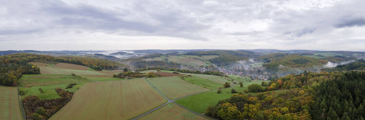 Aerial panoramic view of the fields and forests in the Taunus mountains near Gmunden, Weilrod, Germany. - AAEF20049