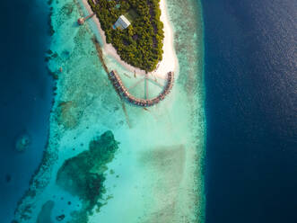 Aerial view of tropical island with a luxury resort on the beach front, Baa Atoll, Maldives. - AAEF20078