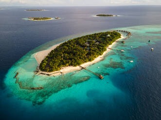 Aerial view of tropical island with water villa, Baa Atoll, Maldives. - AAEF20093