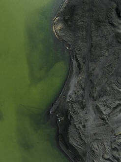 Aerial view of black volcanic coastline in Reykjanesbaer, Southern Peninsula Region, Iceland. - AAEF20137