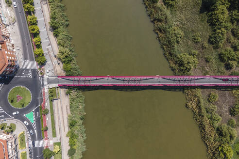 Aerial view of vehicles driving on a roundabout in Talavera de la Reina, a small town along the Tagus river in Toledo district, Spain. - AAEF20261