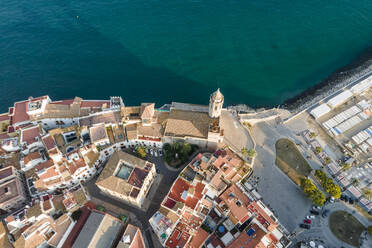 Aerial view of Sitges cathedral along the Mediterranean Sea coastline at sunset, Barcelona, Spain. - AAEF20263