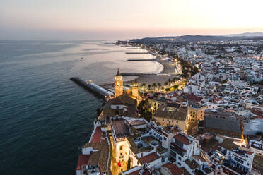 Aerial view of Sitges downtown along the Mediterranean Sea coastline at night, Barcelona, Spain. - AAEF20387