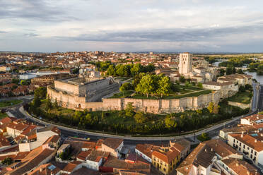 Aerial view of Zamora old town with fortified walls, view of the main cathedral and the castle at sunset, Spain. - AAEF20508