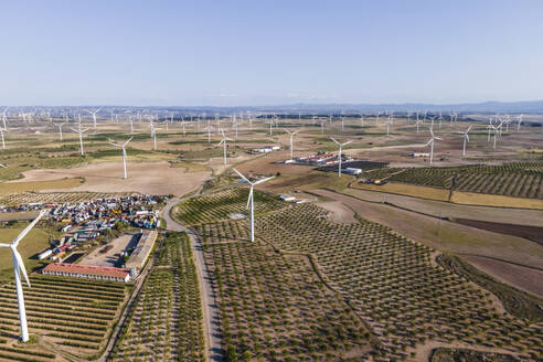 Aerial view of many wind turbines in a wind farm in countryside, La Muela, Zaragoza, Spain. - AAEF20521
