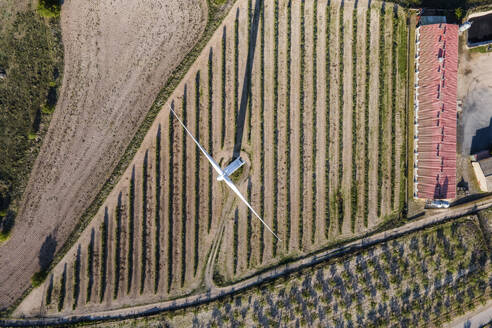 Aerial view of many wind turbines in a wind farm in countryside, La Muela, Zaragoza, Spain. - AAEF20523