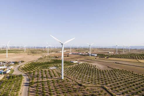 Aerial view of many wind turbines in a wind farm in countryside, La Muela, Zaragoza, Spain. - AAEF20525
