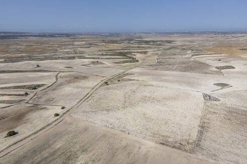 Aerial view of an arid landscape near the Monegros desert, Zaragoza, Spain. - AAEF20537