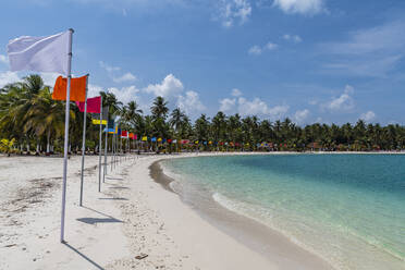 White sand beach with many flags, Bangaram island, Lakshadweep archipelago, Union territory of India, Indian Ocean, Asia - RHPLF26137