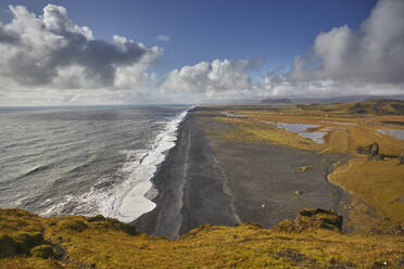 A view from Dyrholaey Island along a vast volcanic black sand beach, near the town of Vik, on the south coast of Iceland, Polar Regions - RHPLF26196