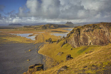 A rugged rocky and watery landscape around Dyrholaey Island, near the town of Vik, southern Iceland, Polar Regions - RHPLF26199