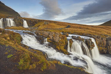 Kirkjufellsfoss Falls, near the port of Grundarfjordur, Snaefellsnes peninsula, western Iceland, Polar Regions - RHPLF26209