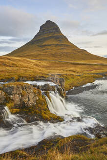 Mount Kirkjufell and Kirkjufellsfoss Falls, near the port of Grundarfjordur, Snaefellsnes peninsula, western Iceland, Polar Regions - RHPLF26210