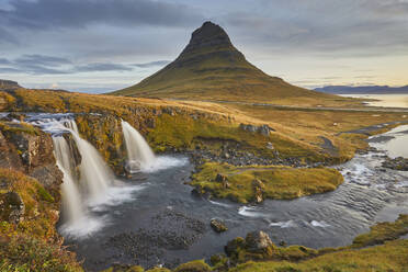 Mount Kirkjufell and Kirkjufellsfoss Falls, near the port of Grundarfjordur, Snaefellsnes peninsula, western Iceland, Polar Regions - RHPLF26212