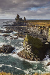 Morning sunlight on the rocks of Londranger, Snaefellsjokull National Park, close to the western tip of the Snaefellsnes peninsula, west coast of Iceland, Polar Regions - RHPLF26219