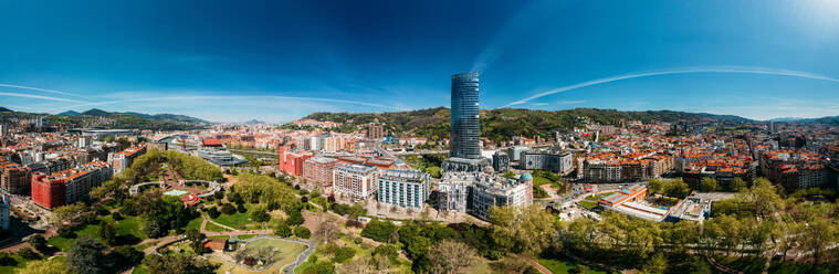 Aerial panoramic view of Bilbao, an industrial port city in northern Spain, is surrounded by green mountains, the de facto capital of Basque Country, Spain, Europe - RHPLF26238
