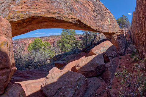 A hidden natural arch near Sliding House Overlook on the south rim of Canyon De Chelly, Arizona, United States of America, North America - RHPLF26253