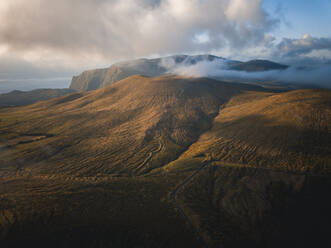 Aerial view at sunset of clouds over Flores island's mountains, Azores islands, Portugal, Atlantic, Europe - RHPLF26264