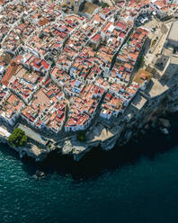 Aerial view of Peniscola, a small town on the rock along the Mediterranean coastline in Castellon, Spain. - AAEF20550