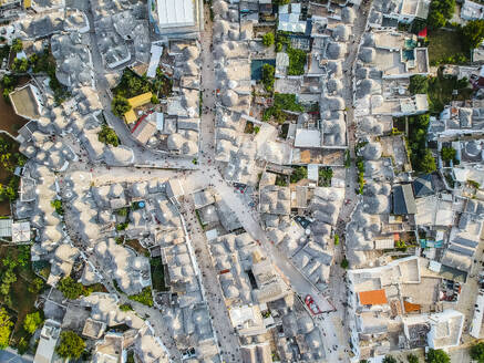 Aerial view of Alberobello with characteristic Trulli, an ancient architecture construction found only in Puglia, Bari, Italy. - AAEF20642