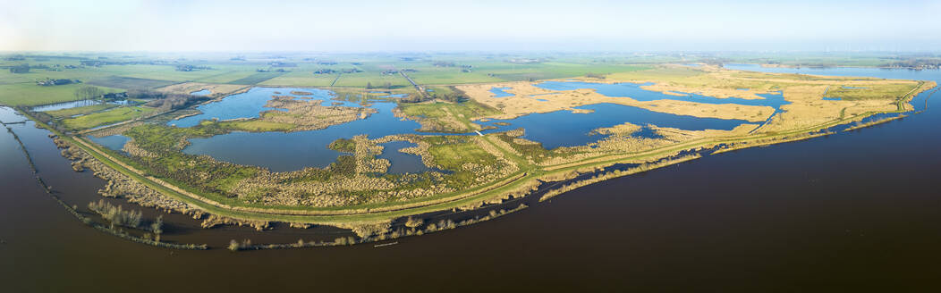 Aerial panorama of the entire nature reserve Tetjehorn with reed swamp and lakes, seen from lake Schildmeer, 't Roegwold, province of Groningen, The Netherlands. - AAEF20783